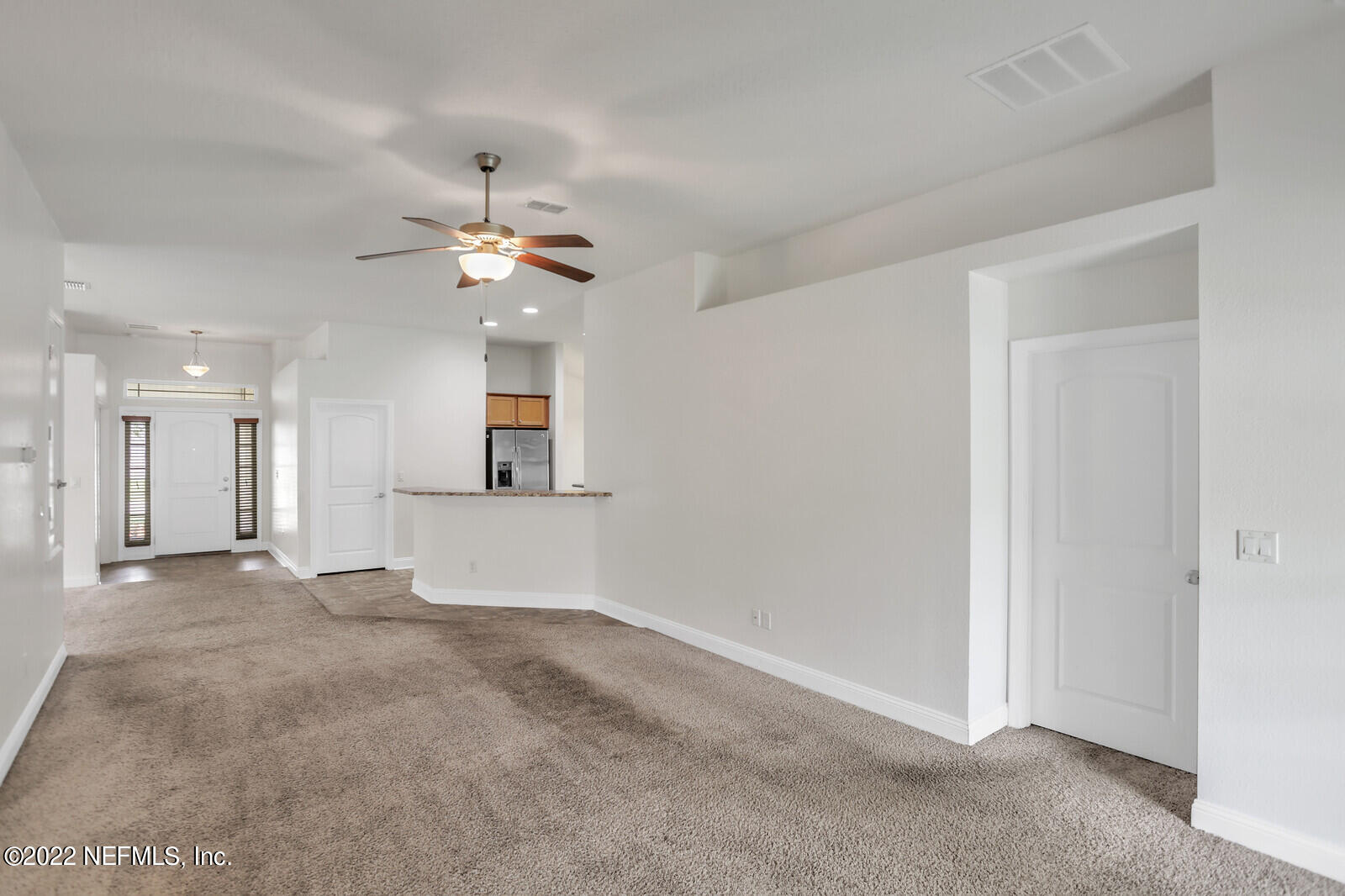 5816 Round Table Road Jacksonville, FL 32254 - Photo 14 of 35 wooden floor in an empty room with a window