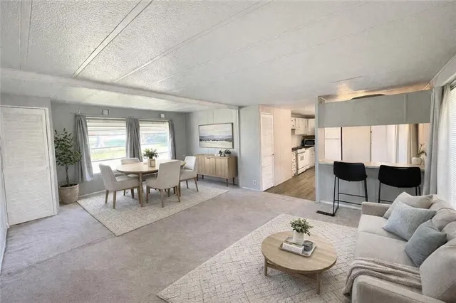 a living room with furniture and a table