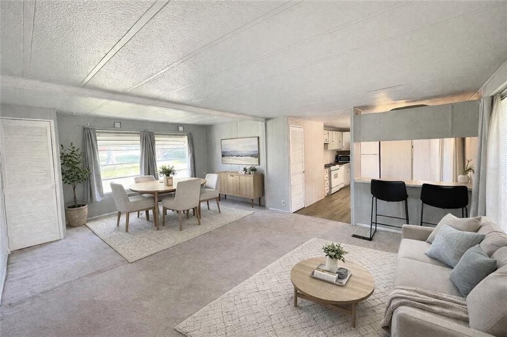 767 Cloverleaf Circle Delmont, PA 15626 - Photo 2 of 12 a living room with furniture and a table