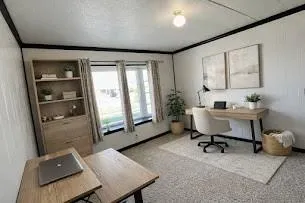a workspace with furniture and window