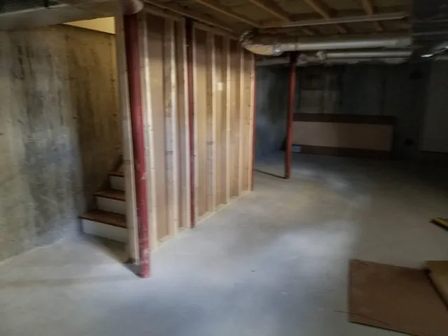 a view of an empty room with stairs