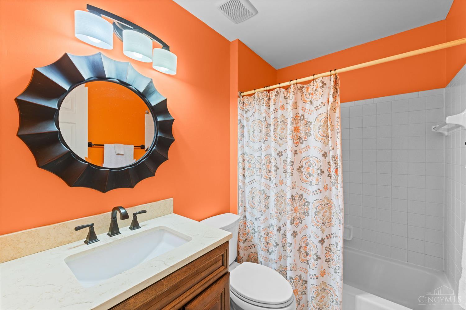 724 Regent Road Cincinnati, OH 45245 - Photo 40 of 67 Hall bath for bedrooms 2 - 4. Updated fixtures, new toilet, updated vanity and mirror.