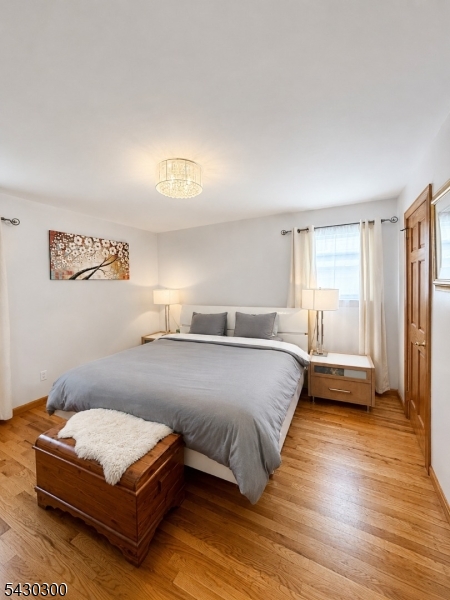 25 Spring Street, Unit A Millburn, NJ 07041 - Photo 8 of 21 a bedroom with a bed and window