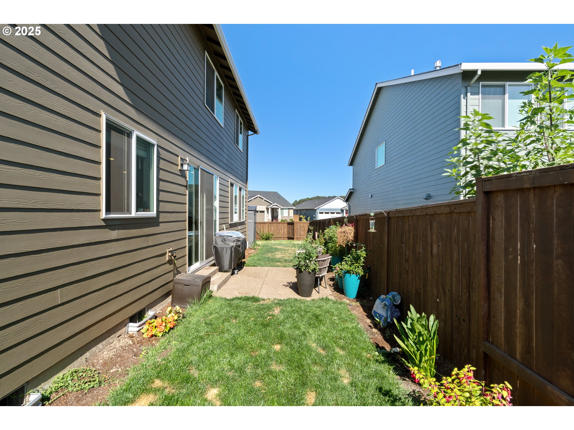 6099 Savannah Street Southeast Albany, OR 97322 - Photo 31 of 32 a view of a backyard with plants and a patio