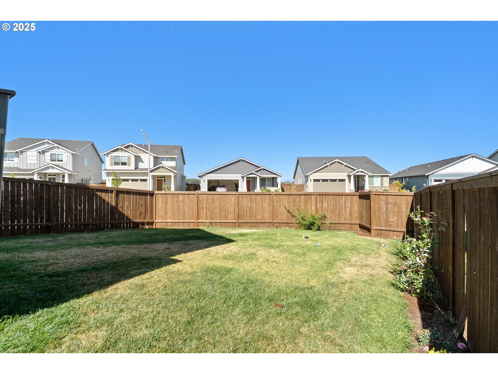 6099 Savannah Street Southeast Albany, OR 97322 - Photo 32 of 32 a view of an house with backyard and garden