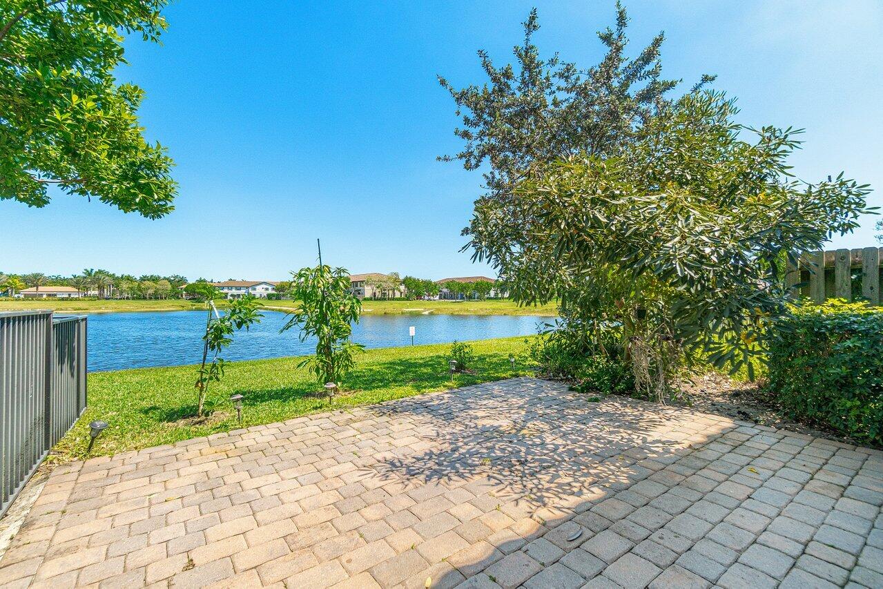 12949 Anthorne Lane Boynton Beach, FL 33436 - Photo 32 of 37 a view of a pathway with a garden