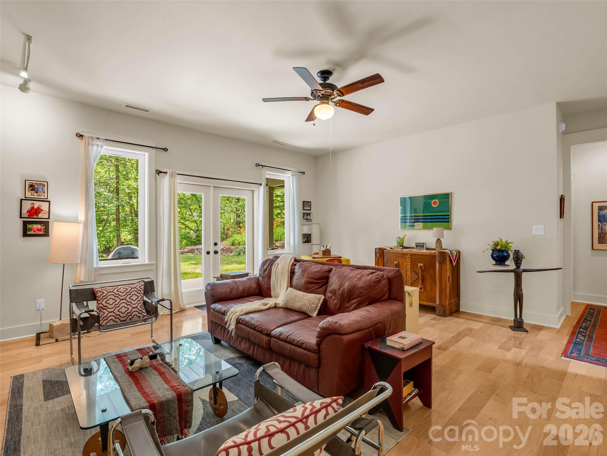 120 Glenn Court Mill Spring, NC 28756 - Photo 29 of 48 a living room with furniture a large window and a table