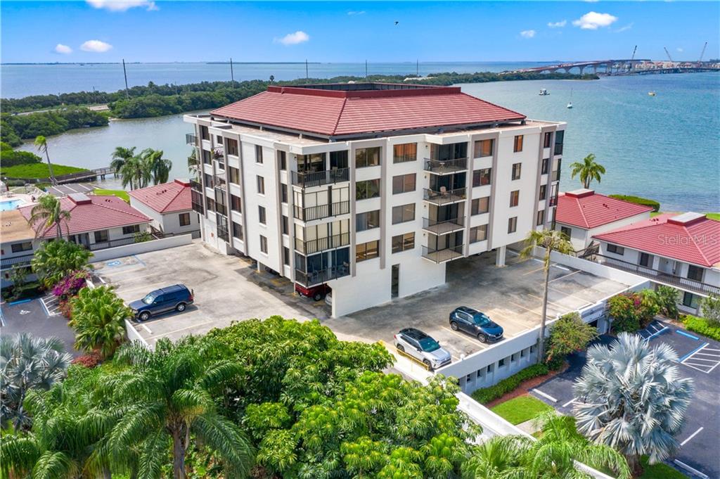 6361 Bahia Del Mar Blvd S #303 with Boca Ciega Bay and parking spot 74 to the left.