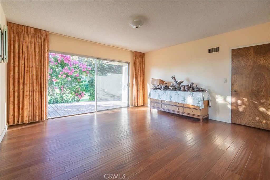 920 South Spring Meadow Drive West Covina, CA 91791 - Photo 17 of 48 a view of a room with wooden floor and window