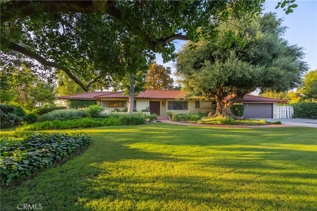 920 South Spring Meadow Drive West Covina, CA 91791 - Photo 39 of 48 a front view of a house with a garden