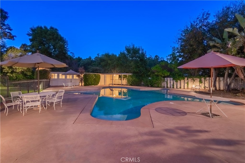 920 South Spring Meadow Drive West Covina, CA 91791 - Photo 45 of 48 a view of a patio with a table and chairs under an umbrella