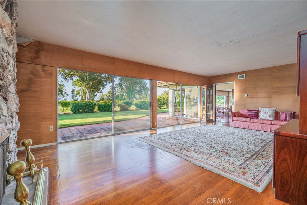 920 South Spring Meadow Drive West Covina, CA 91791 - Photo 9 of 48 a view of a living room and floor to ceiling window hardwood floor