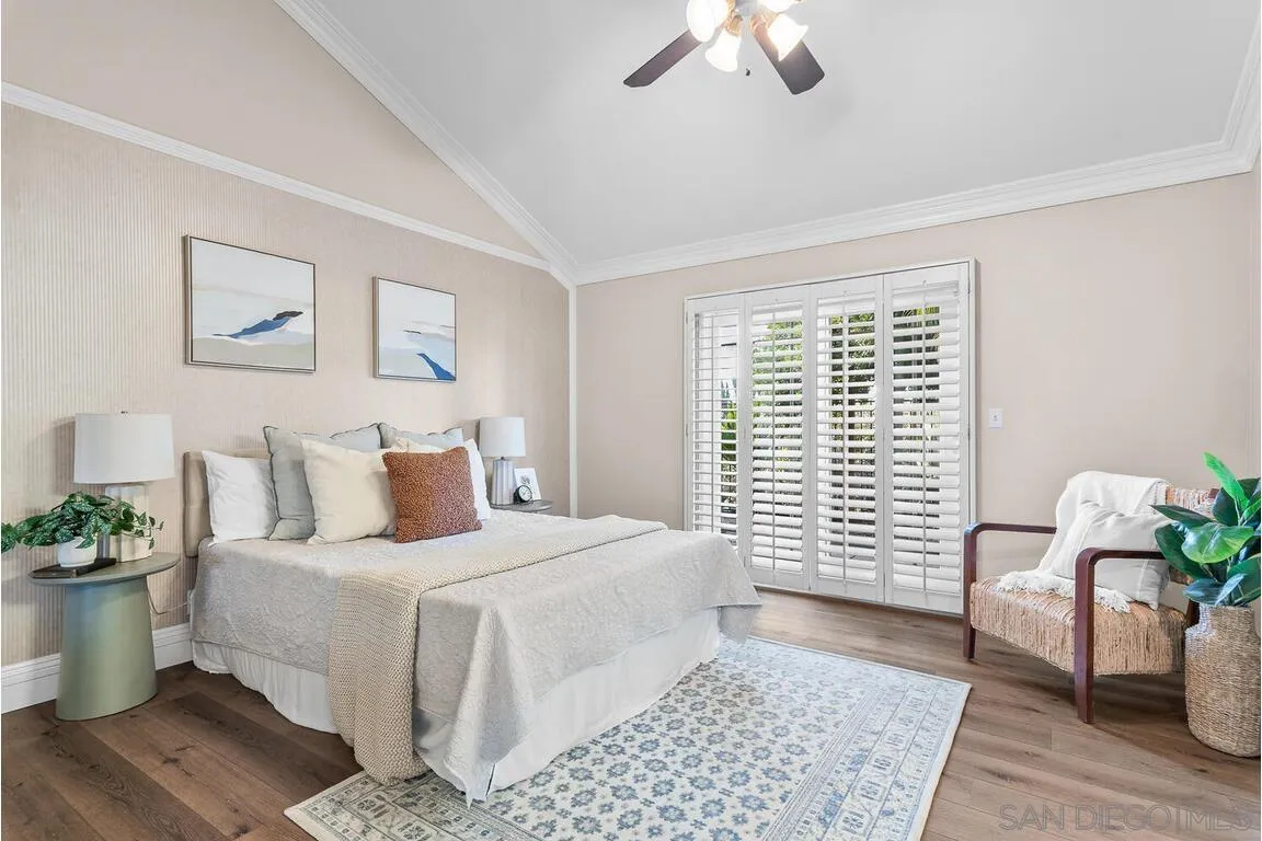 9160 Paseo Cresta Santee, CA 92071 - Photo 16 of 42 a bedroom with a large bed and a couch