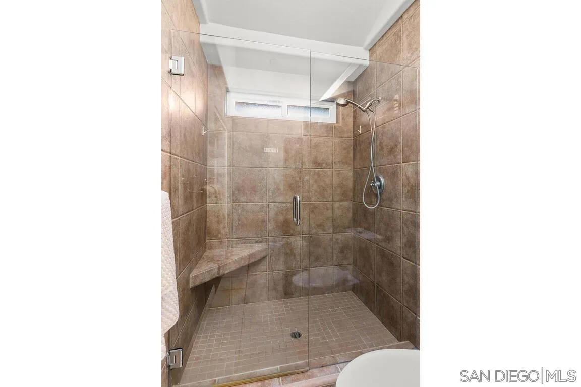 9160 Paseo Cresta Santee, CA 92071 - Photo 20 of 42 a bathroom with a glass shower door