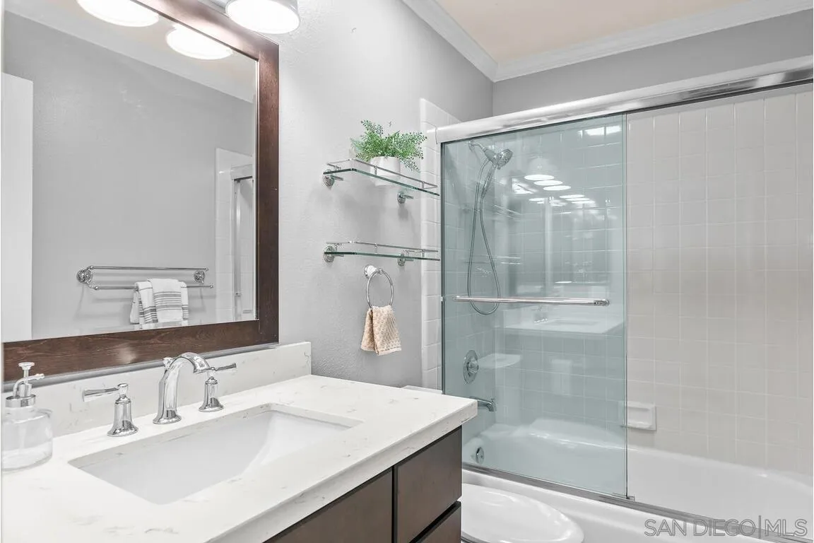 9160 Paseo Cresta Santee, CA 92071 - Photo 22 of 42 a bathroom with a bathtub shower sink vanity and mirror