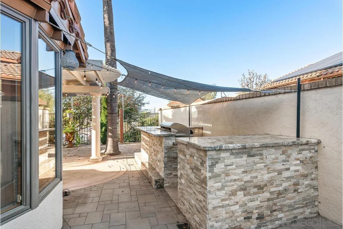 9160 Paseo Cresta Santee, CA 92071 - Photo 32 of 42 a view of a patio with table and chairs