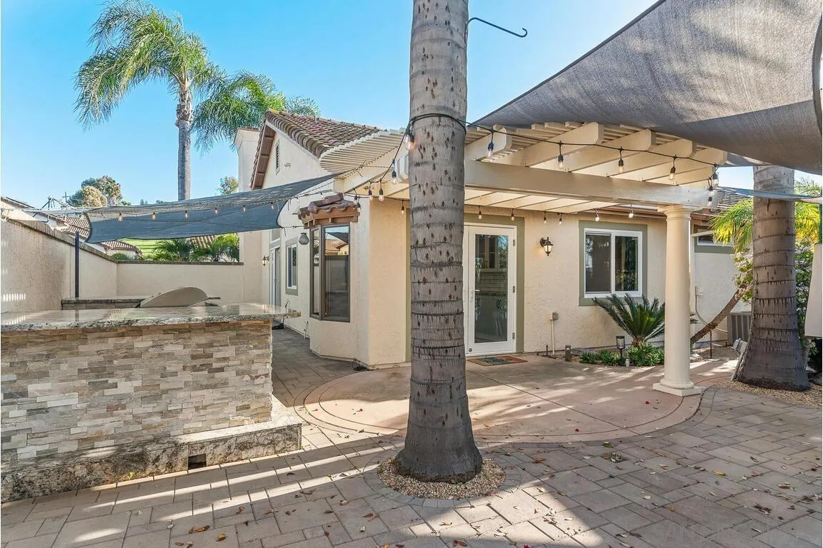 9160 Paseo Cresta Santee, CA 92071 - Photo 36 of 42 a front view of a house with garden