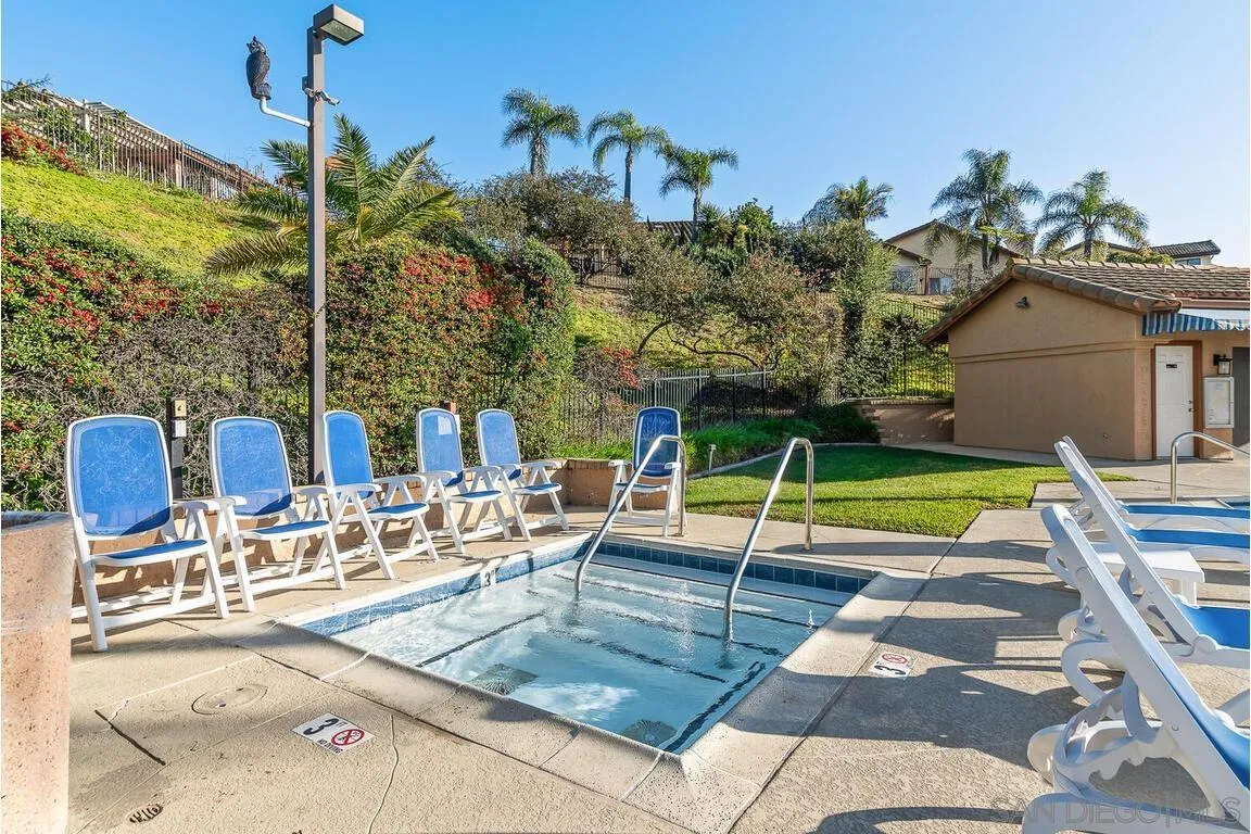 9160 Paseo Cresta Santee, CA 92071 - Photo 42 of 42 a view of a swimming pool with a lounge chairs