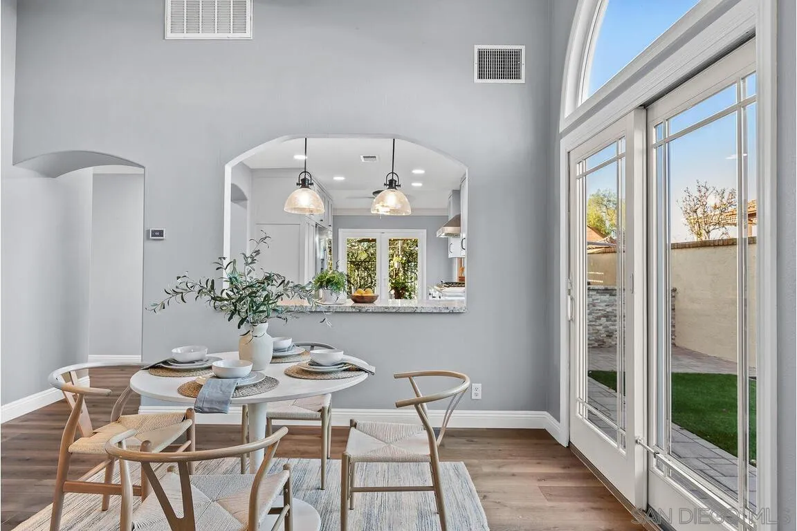 9160 Paseo Cresta Santee, CA 92071 - Photo 7 of 42 a view of a dining room with furniture window and wooden floor