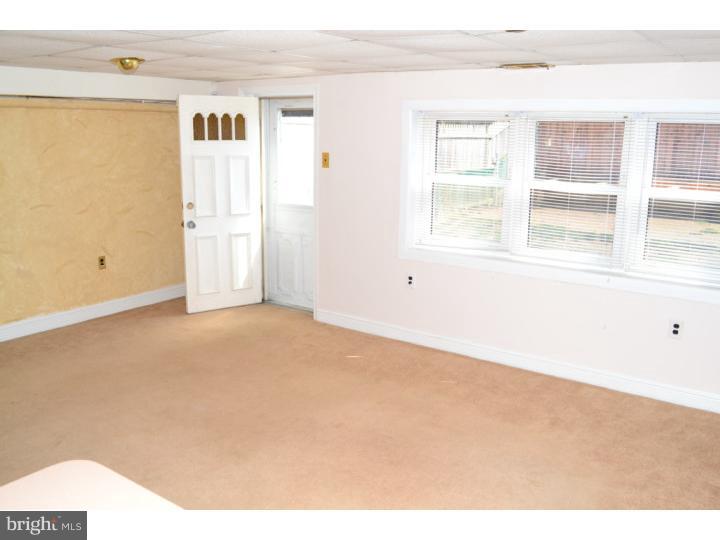 12023 Tyrone Road Philadelphia, PA 19154 - Photo 13 of 16 an empty room with windows