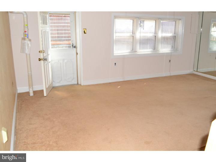 12023 Tyrone Road Philadelphia, PA 19154 - Photo 15 of 16 a view of empty room with windows