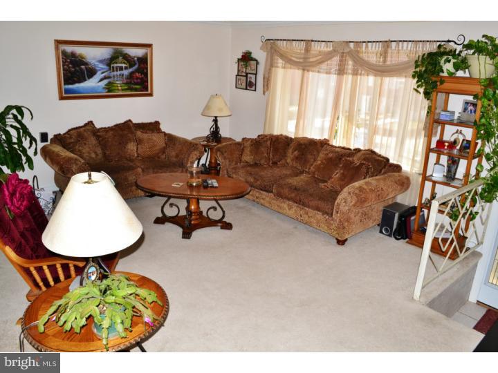 12023 Tyrone Road Philadelphia, PA 19154 - Photo 4 of 16 a living room with furniture and a large window