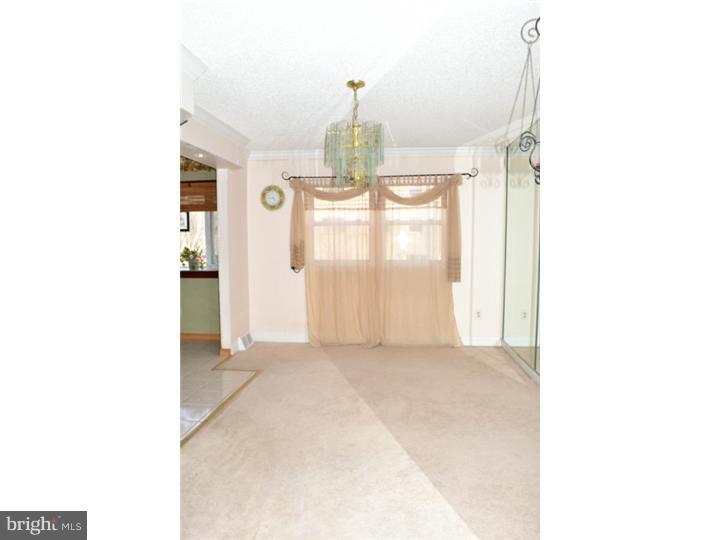 12023 Tyrone Road Philadelphia, PA 19154 - Photo 8 of 16 a view of a room with windows and cabinet