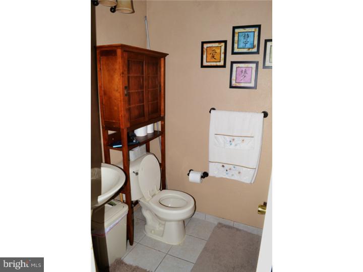12023 Tyrone Road Philadelphia, PA 19154 - Photo 10 of 16 a bathroom with a toilet and a shower