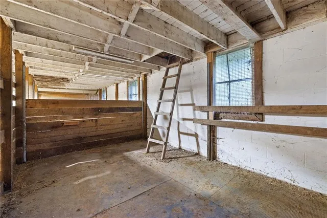 a view of a room with wooden walls