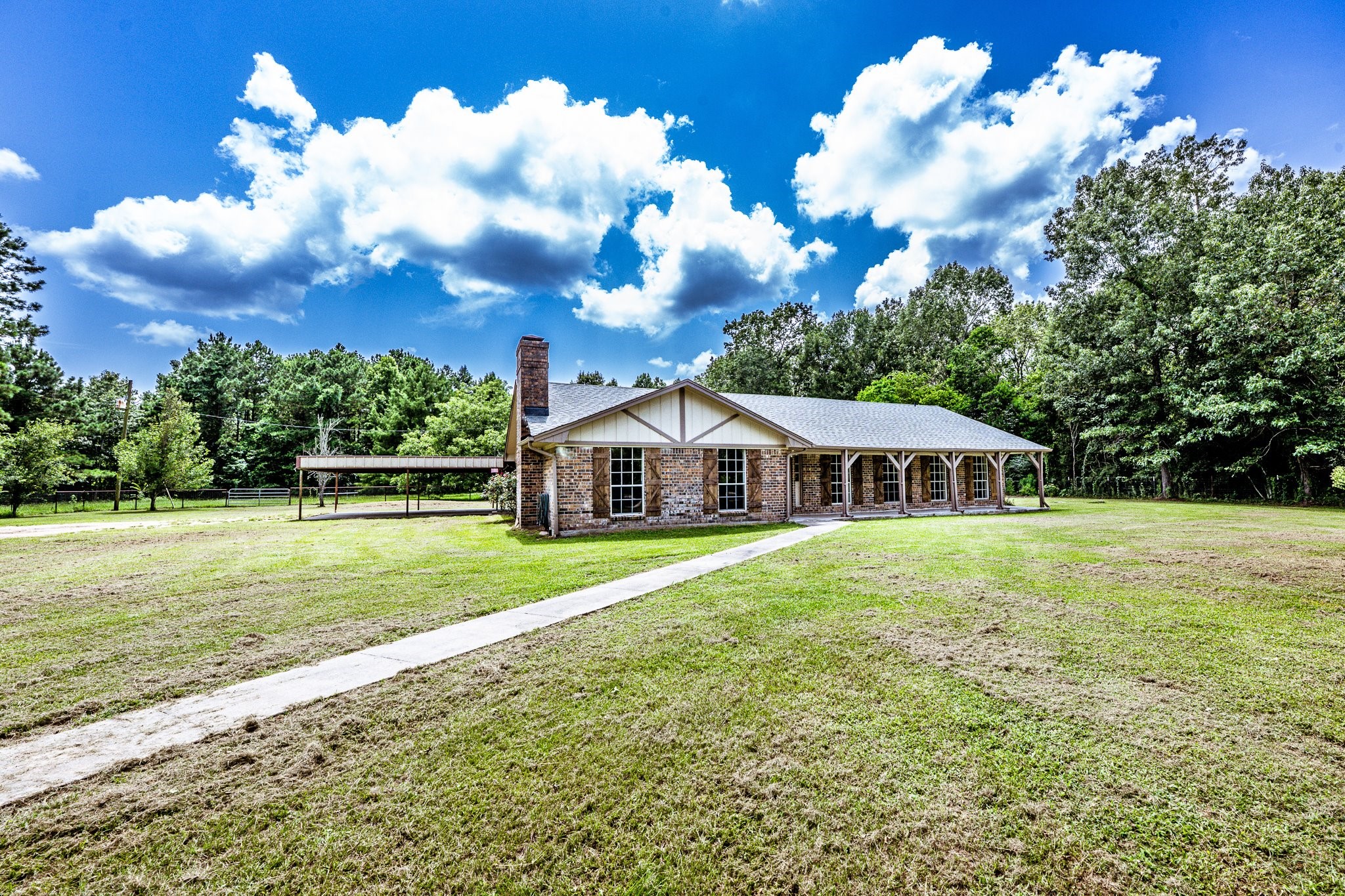 92 Mt Zion Road New Waverly, TX 77358 - Photo 16 of 33 a view of a house with a yard