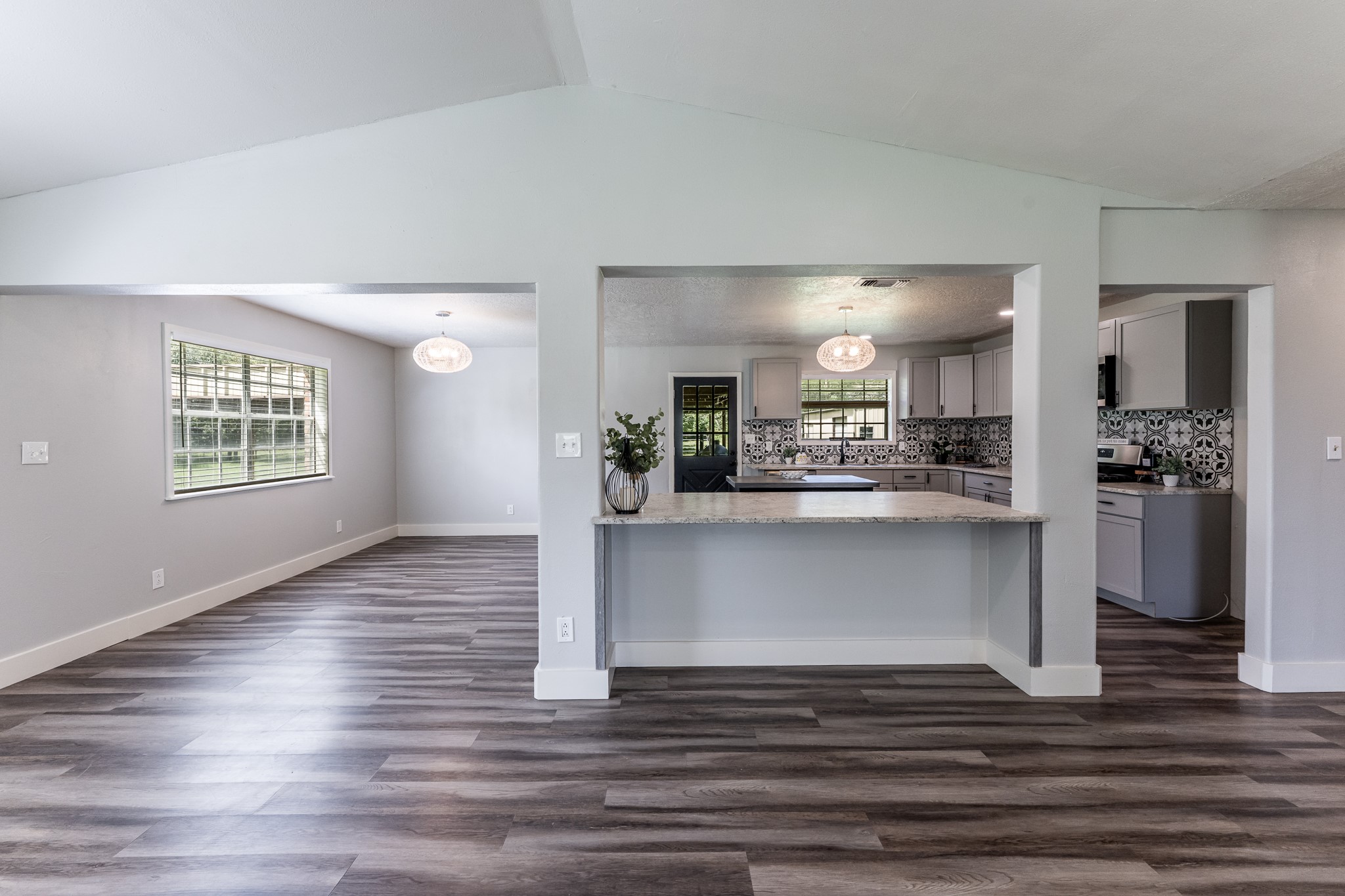 92 Mt Zion Road New Waverly, TX 77358 - Photo 7 of 33 a view of kitchen and hall with wooden floor