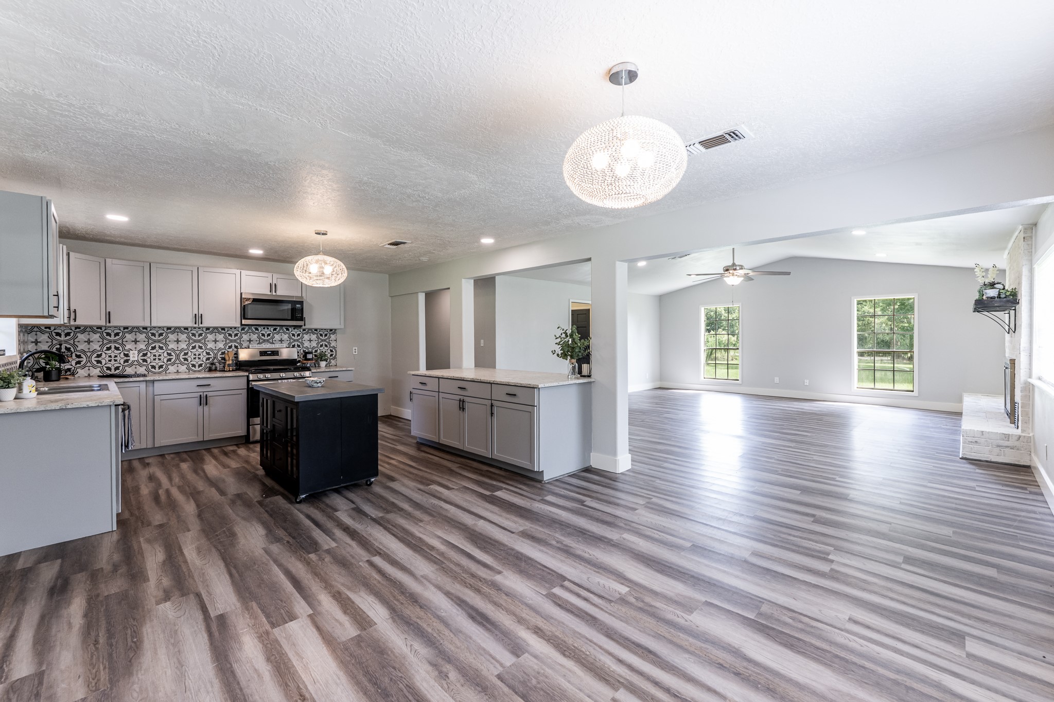 92 Mt Zion Road New Waverly, TX 77358 - Photo 8 of 33 a kitchen with stainless steel appliances kitchen island wooden cabinets and granite counter tops