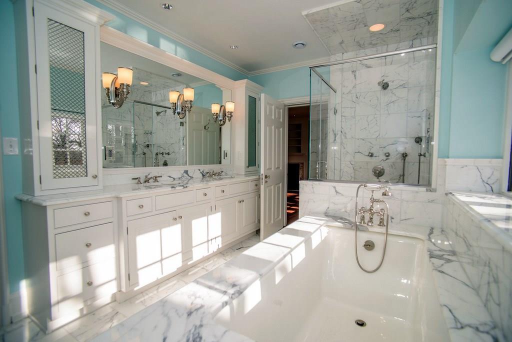 899 Persimmon Road Sewickley Heights, PA 15143 - Photo 19 of 25 Master Ensuite full bathroom; totally rebuilt- new cabinetry; heated marble floors & countertops; dual twin sinks; heated towel bars; custom cabinets & mirror; deep tub; shower with "Waterworks" controls