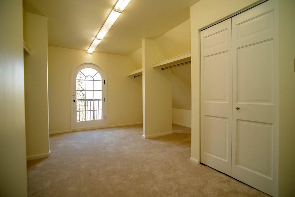 899 Persimmon Road Sewickley Heights, PA 15143 - Photo 21 of 25 Full walk-in closet on the third floor, with wall to wall carpeting, and new lighting; adjacent storage room with linen drawers (historic area preserved from 1930)
