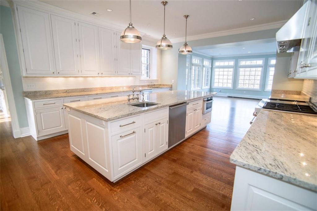 899 Persimmon Road Sewickley Heights, PA 15143 - Photo 10 of 25 New state-of-the-art kitchen; new floors, island, cabinets, counters, lighting, and storage; 2 sub zero refrigerators & freezers; Wolf cooking System; 2 Miele dishwashers; 2 sinks; 2 disposals; walk-in adjacent pantry