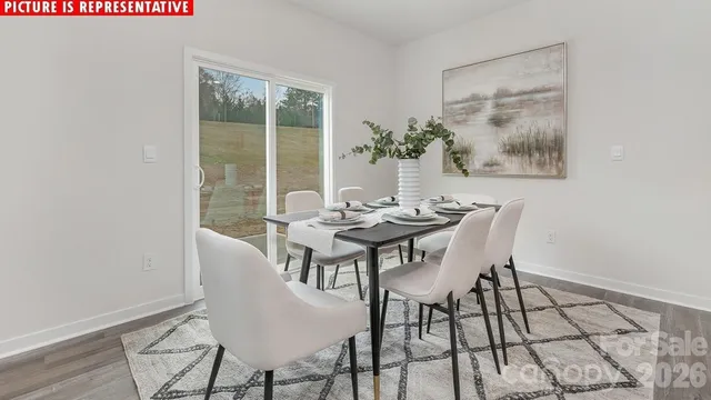 a view of a dining room with furniture and window