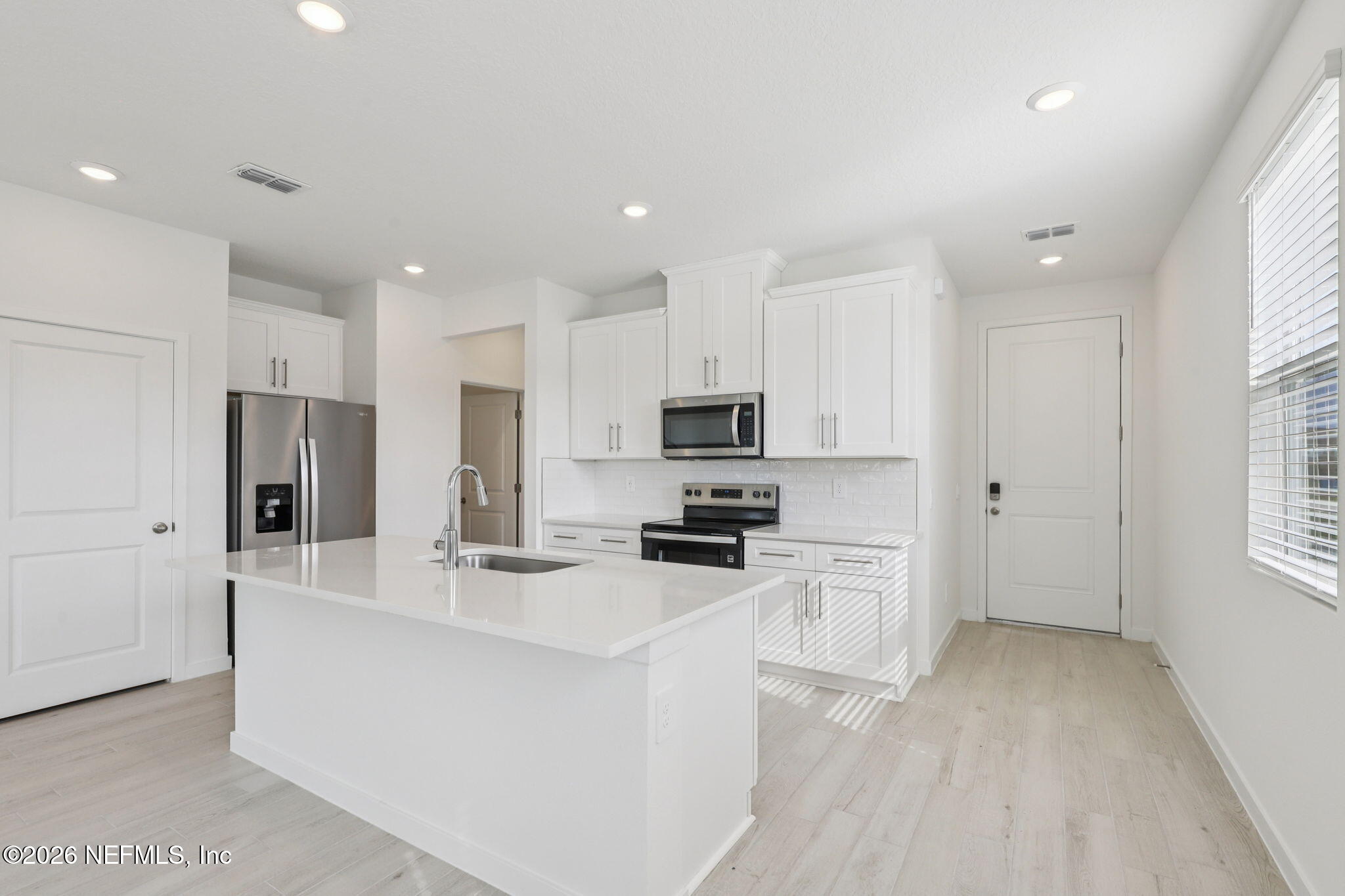 25 Rangeline Drive St. Augustine, FL 32092 - Photo 6 of 43 a kitchen with stainless steel appliances a refrigerator sink and cabinets