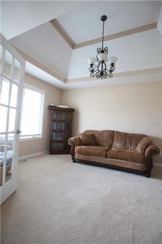 Formal living room off entry could function as formal dining as well. Just look at the gorgeous ceilings!