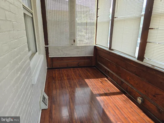 a view of wooden floor in a bathroom