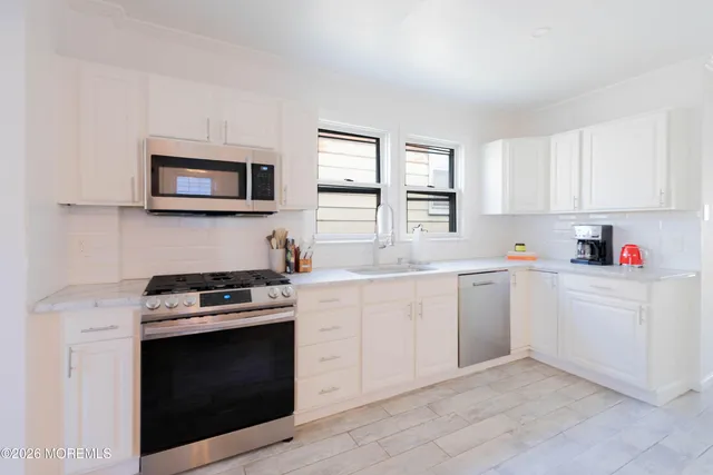 a bed room with a bed and a window