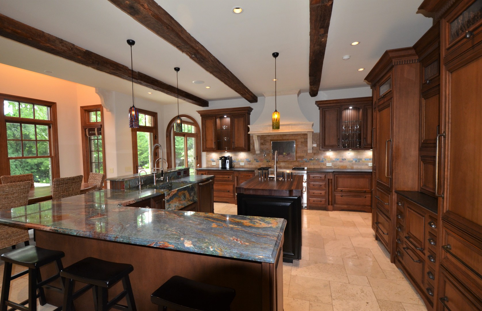 1230 Heather Lane Glenview, IL 60025 - Photo 11 of 38 a large kitchen with granite countertop a large counter top furniture and a stove