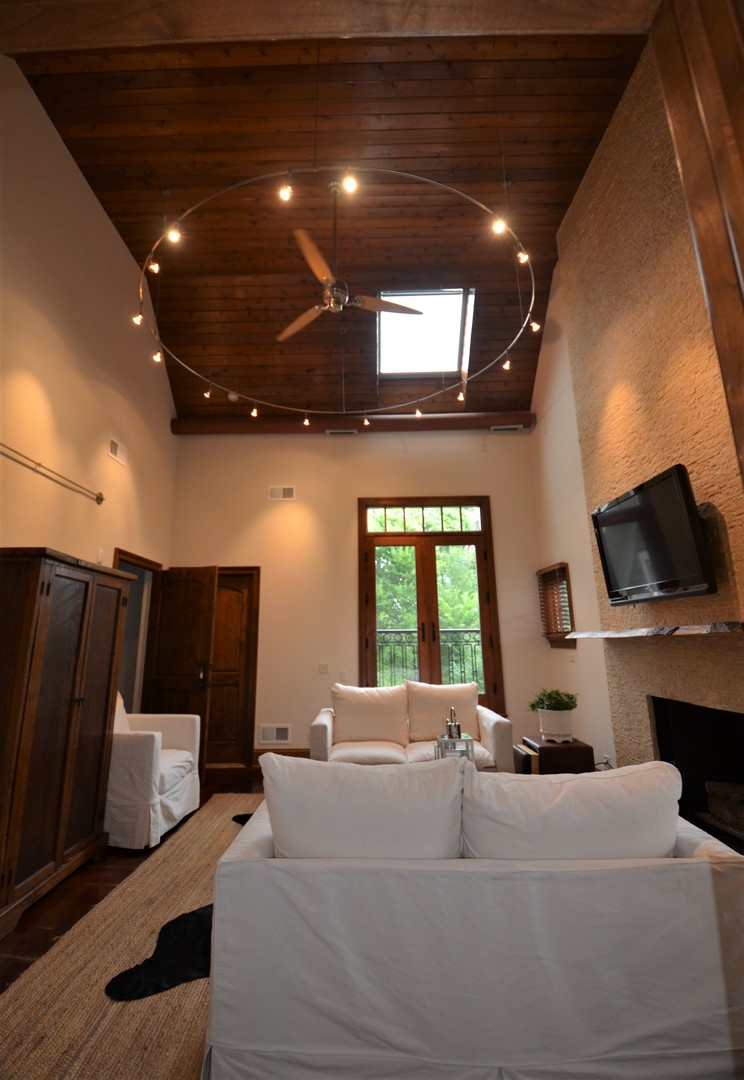 1230 Heather Lane Glenview, IL 60025 - Photo 18 of 38 a living room with furniture a fireplace and a flat screen tv