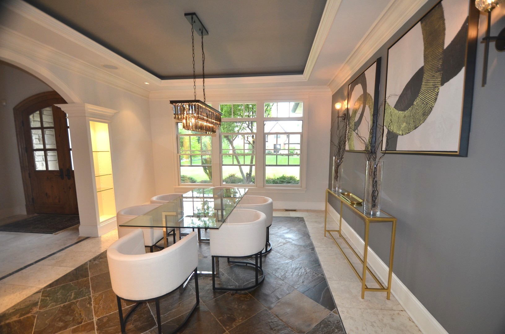 1230 Heather Lane Glenview, IL 60025 - Photo 2 of 38 a hallway with a couch and chandelier