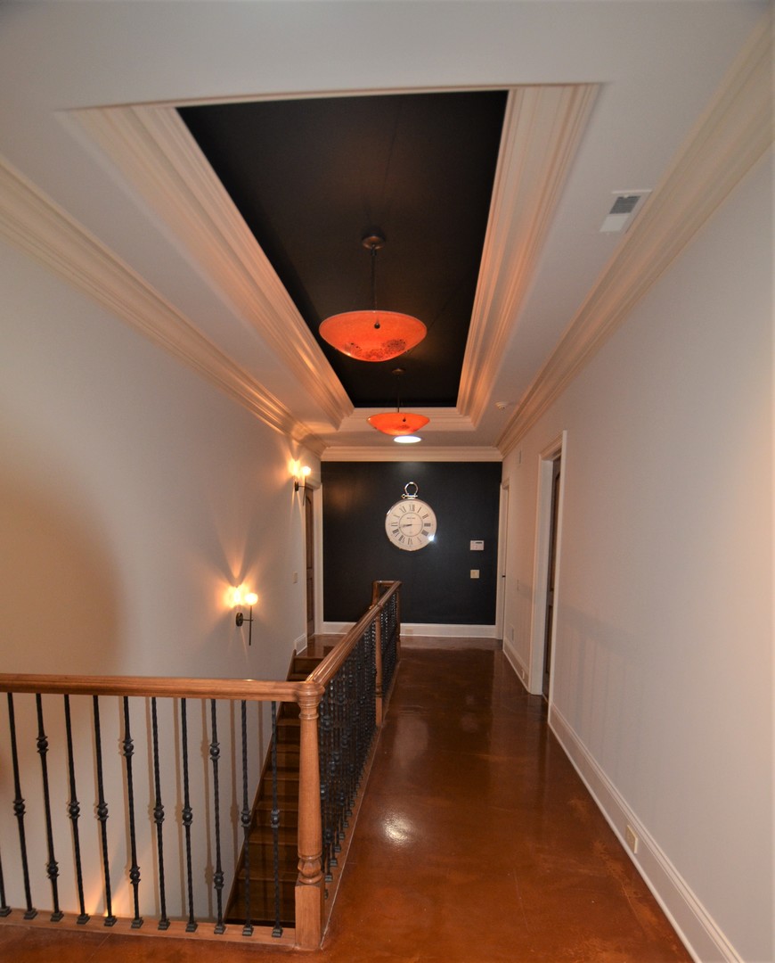 1230 Heather Lane Glenview, IL 60025 - Photo 23 of 38 a hallway with paintings on the wall