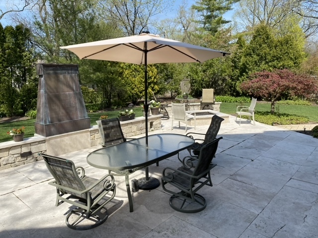 1230 Heather Lane Glenview, IL 60025 - Photo 32 of 38 a view of a patio with table and chairs under an umbrella