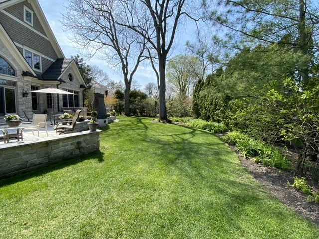 1230 Heather Lane Glenview, IL 60025 - Photo 33 of 38 a backyard of a house with table and chairs