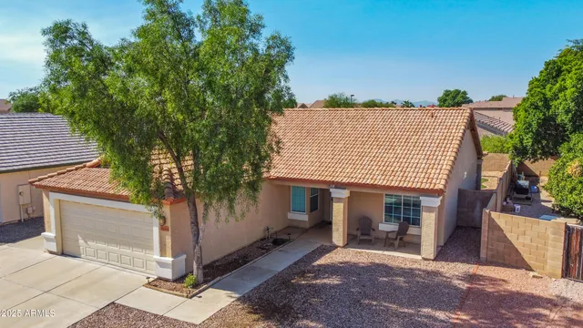 aerial view of a house with a garden