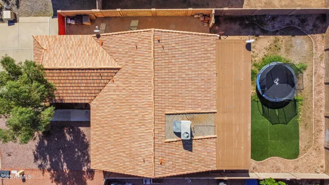 swimming pool view with a seating space