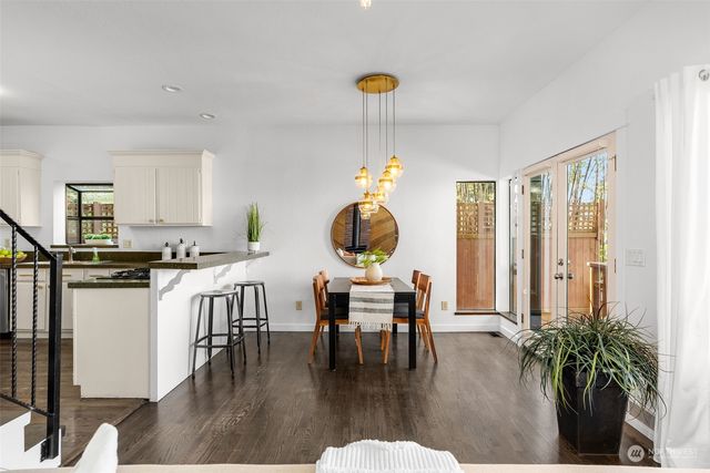 a living room with furniture a window and kitchen view
