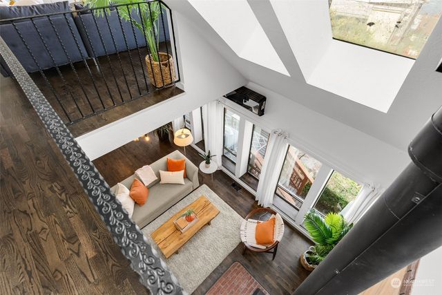 a view of an entryway with wooden floor